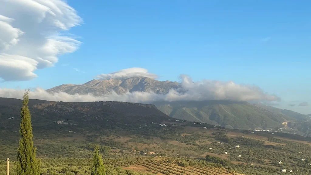 Panoramic view of Mount Maroma near Sedella in the Axarquía, featuring a striking mountain massif and clear visibility.
